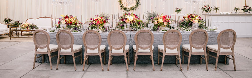 classic louis chair with wooden frame and rattan back