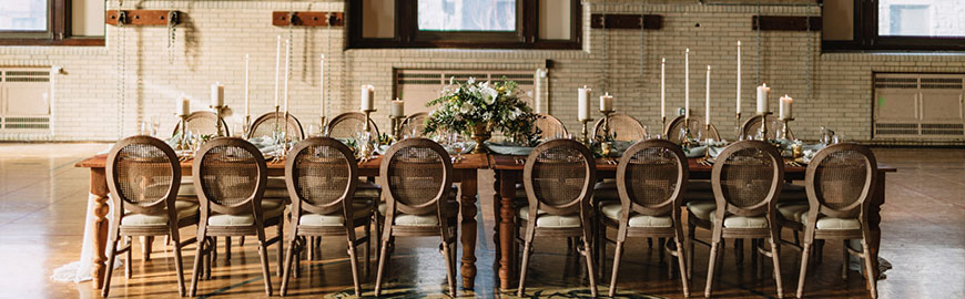 chateau louis chair with rattan back at reclaimed wood farm tables