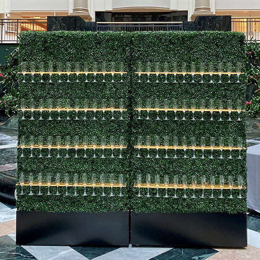 topiary wall with shelves for champagne flutes